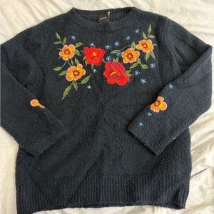 Chic Black Floral Sweater with Red and Orange Accents